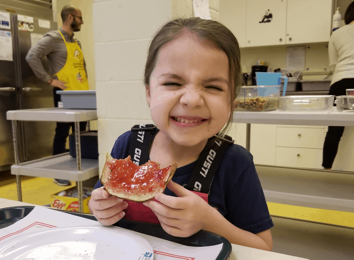 Girl eating toast with jam