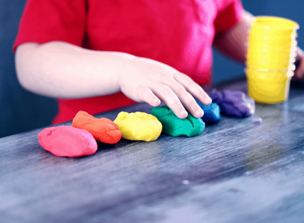 child playing with play-doh