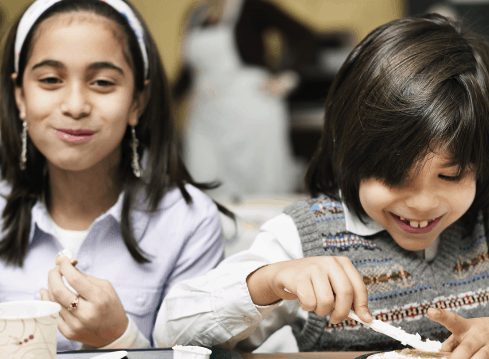 children enjoying breakfast together